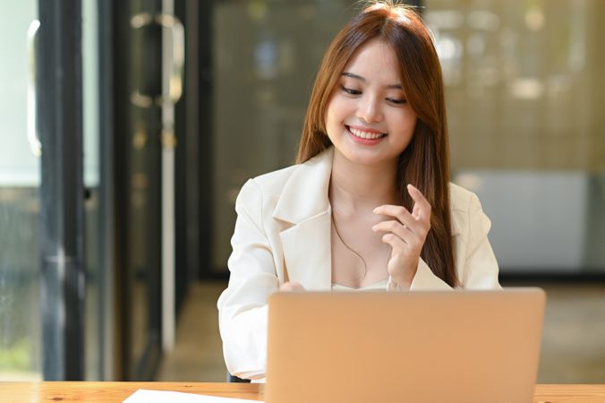 Business woman having an online meeting in the office.