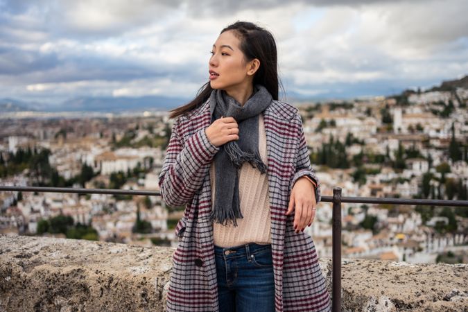 Cheerful woman visiting ancient city
