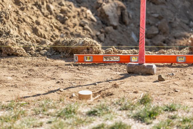 Guide Line, Level and Sledge Hammer At Construction Site