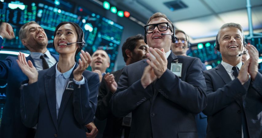 Group of Successful Stock Exchange Brokers Celebrating a Profitable Investment Bid on a Securities Market.