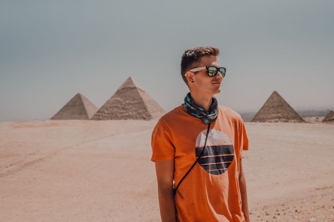 Young man against Great Pyramids