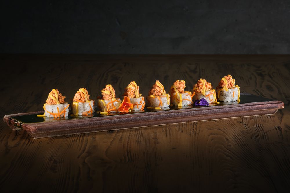 Delicious sushi served on plate in restaurant