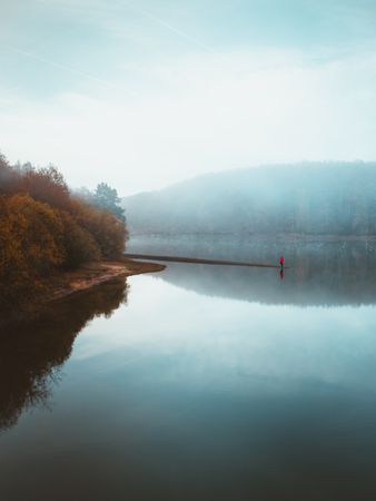 Beautiful tranquil lake in fog