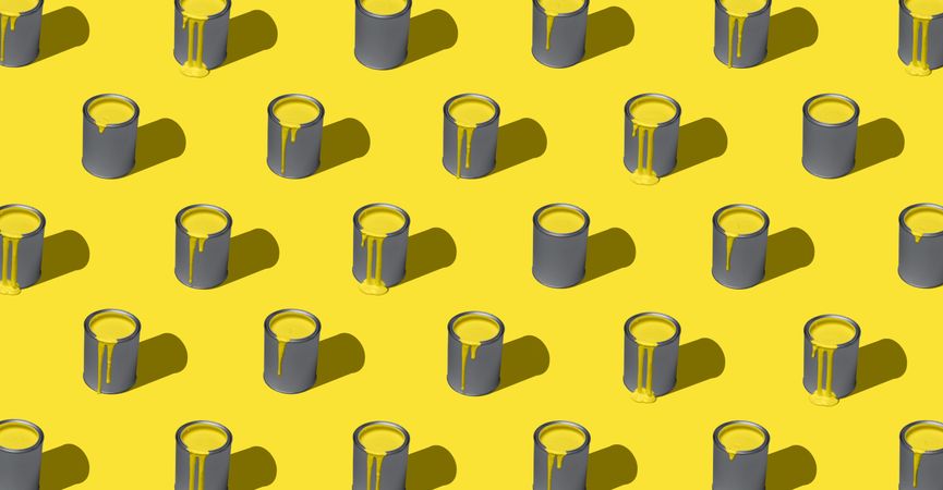 Yellow paint in tin can, pattern, isolated on yellow background