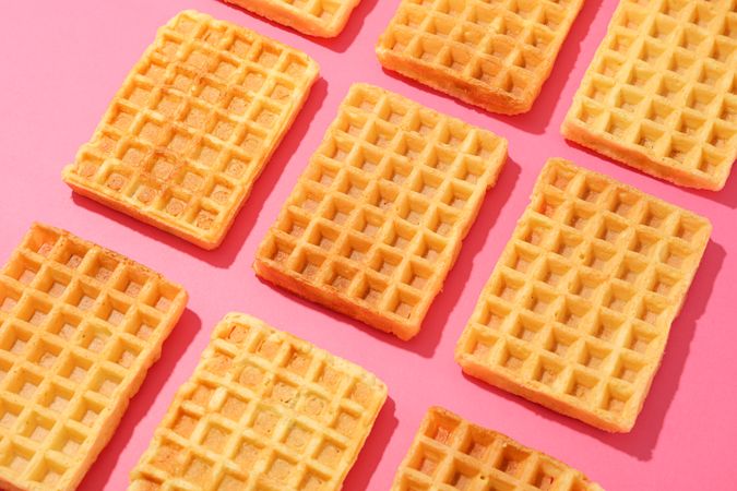 Flat lay composition with waffles on color background