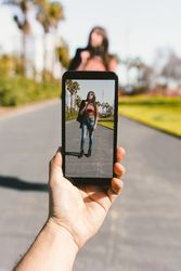 Hand taking shot of modern woman