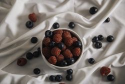 Appetizer plateful of berry on silk cloth
