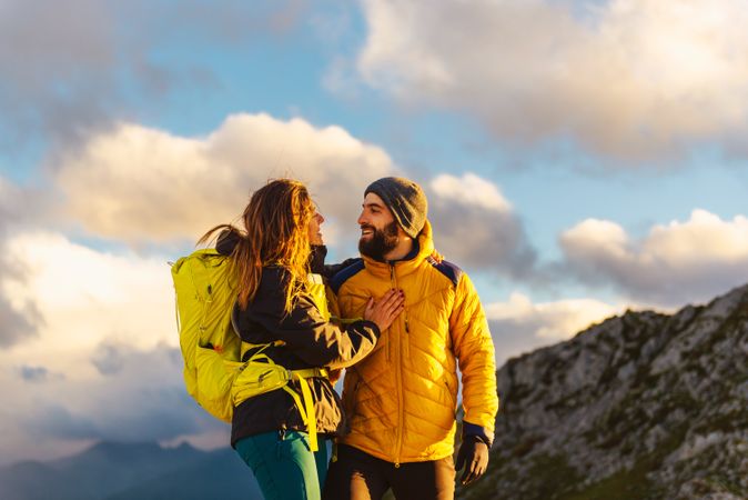 man and woman hiking in the mountains