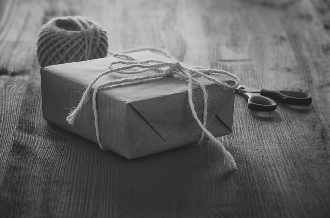 Present wrapped in brown paper, monochrome
