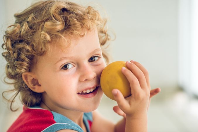 Smiling boy with small ball