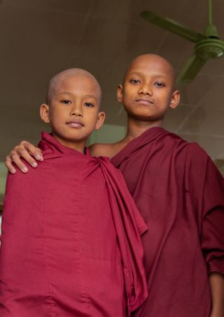 Mandalay, Myanmar - June, 25 2012: Monk boys standing in queue for food
