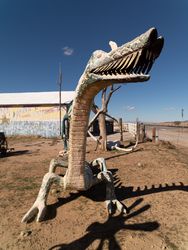 Dragon statue in dirt lot in Arizona desert x42Ry4