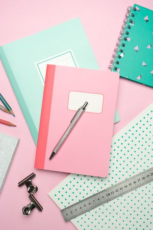 School stationery set on pink background
