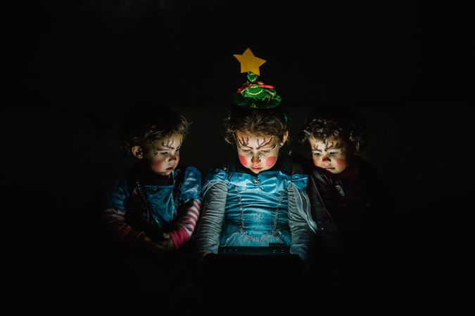 three little princess girls with computer