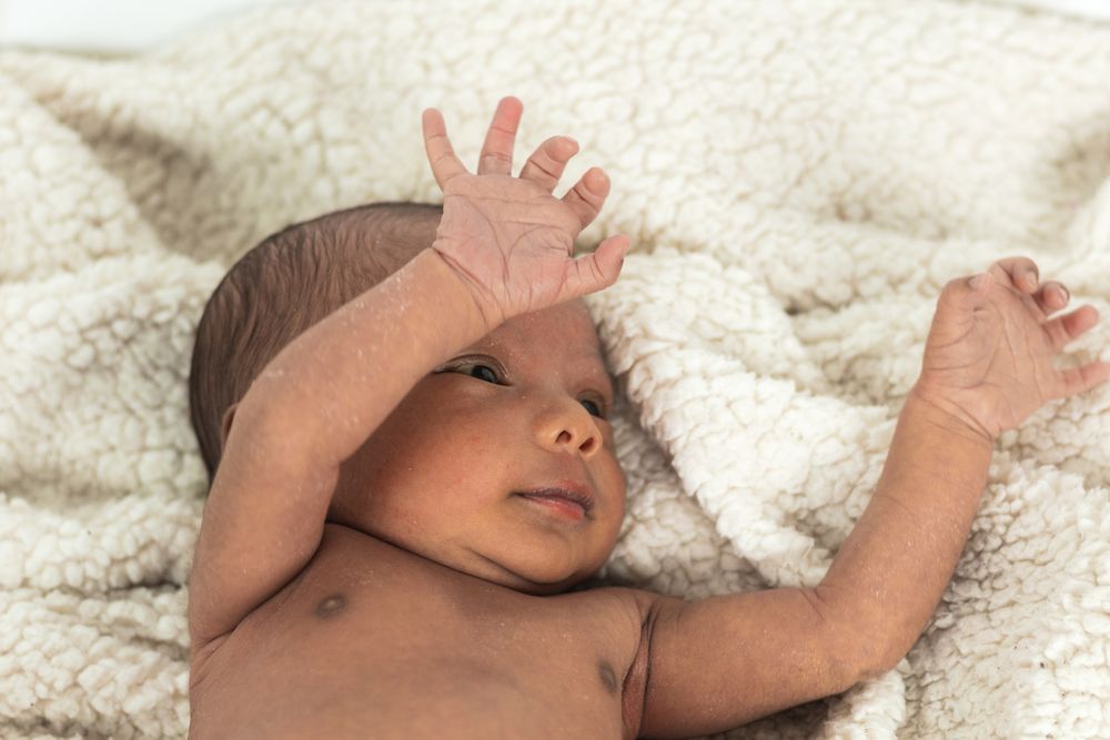 Newborn baby on soft blanket