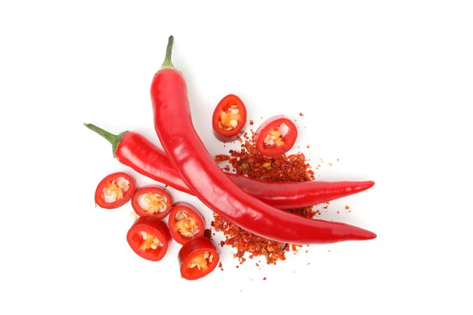 Chilli peppers and spice isolated on blank background