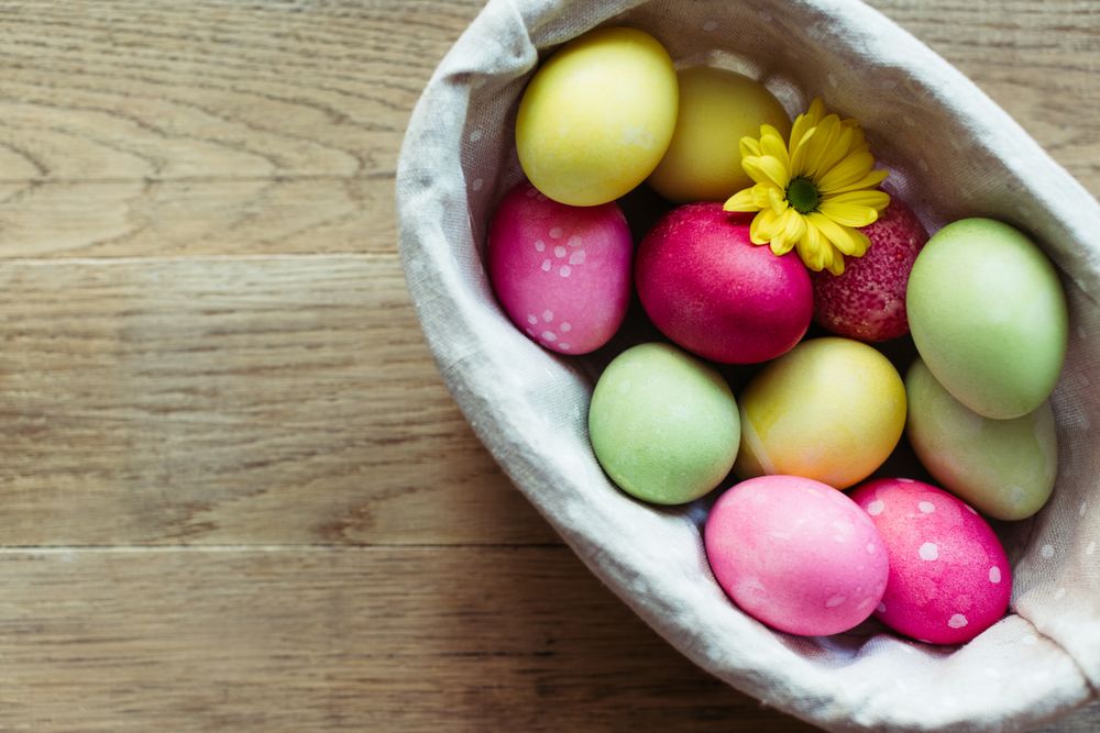 Flowers and Easter eggs on table