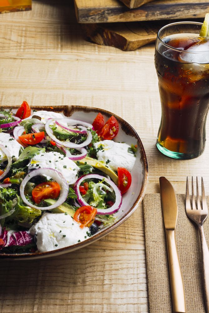 Vegetables salad with onion greens and cream sauce