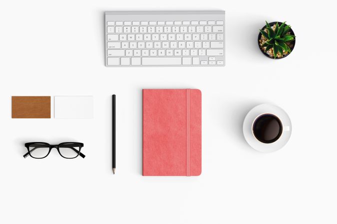 Modern workspace with coffee cup, keyboard and notebook copy space