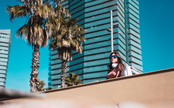 Teen girl watching the street while listening to music.