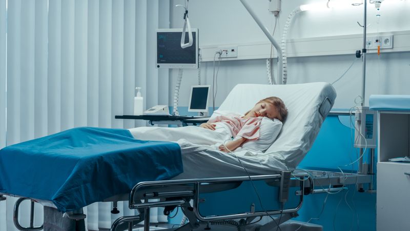 Cute Little Sick Girl Sleeps on a Bed in the Children's Hospital