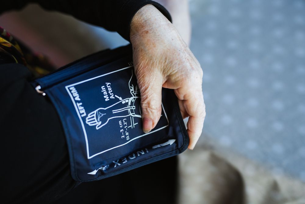 Older female measuring blood pressure