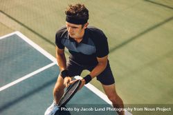 Professional tennis player playing a match on hard court bYXmd4