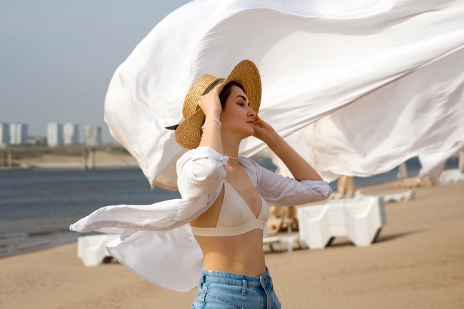 Woman on beach on windy day