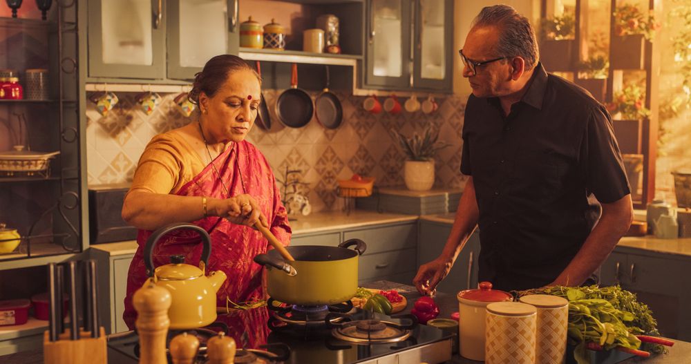 Indian Couple Exploring Traditional Cooking: Preserving Culinary Heritage, Preparing Authentic Recipes with Love and Care.