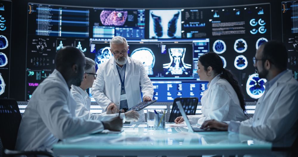 Chief Doctor Conducting a Pre-Operative Assessment Meeting With His Surgical Team.