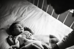 Anonymous father wishing good night to baby