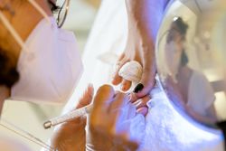 Toe nails being painted in salon