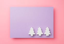 Light pine trees on purple background