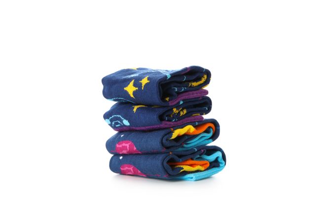 Stack of socks isolated on light background