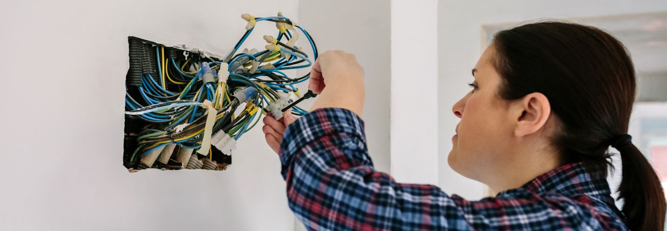 Electrician working on the electrical installation of a house