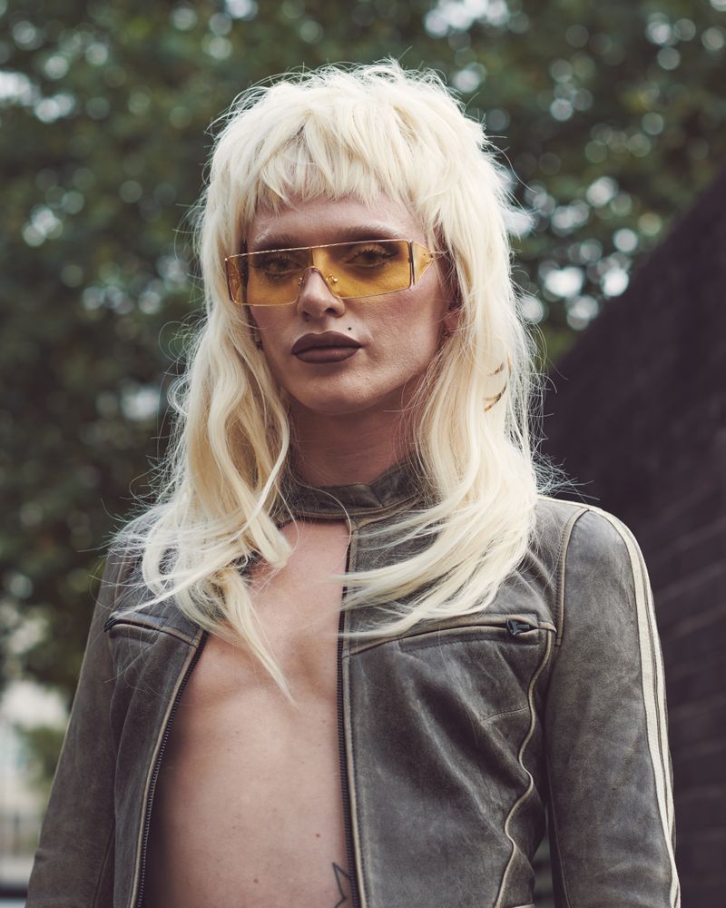 London, England, United Kingdom - September 18 2021: Person in blond wig and square yellow glasses