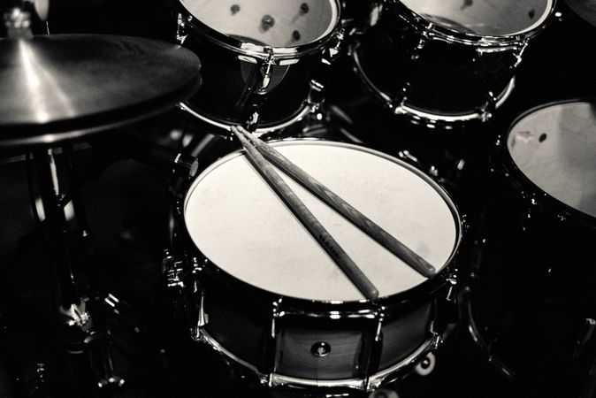 Drum set on stage in blue neon spotlights