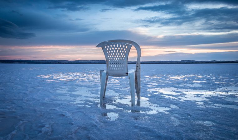 Chair on salt mine during sunset