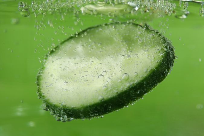 Slice of cucumber submerged in water