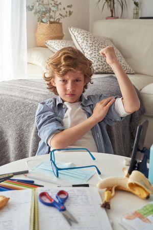 Angry child staying home and doing homework