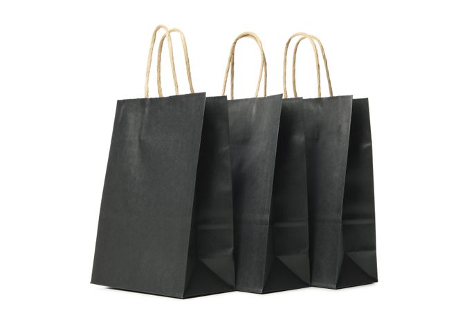 dark paper bags isolated on light background