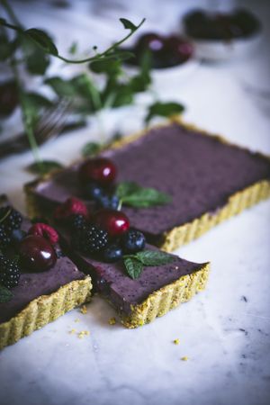 Fresh blueberry pistachio cake with whole berries on top