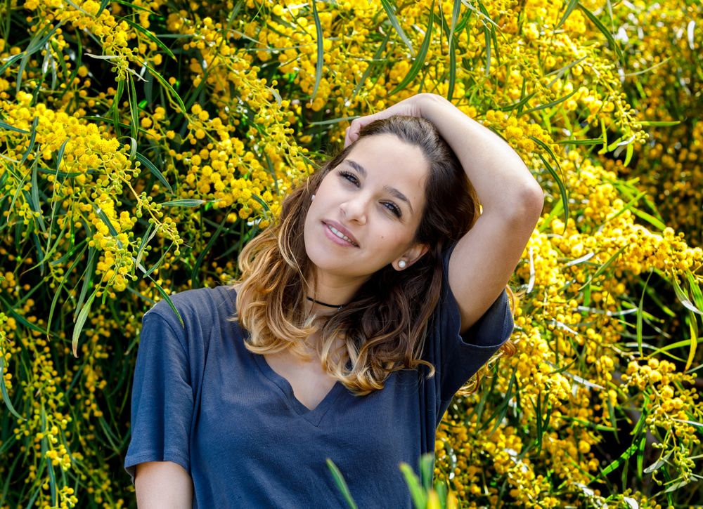 Young female near blooming bushes