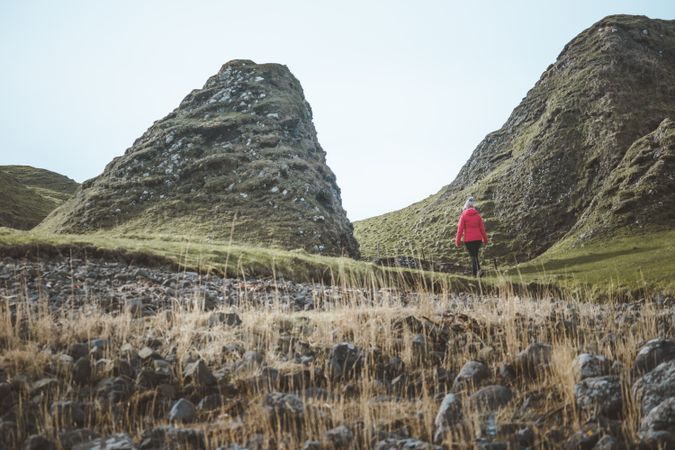 Woman walking along mountain