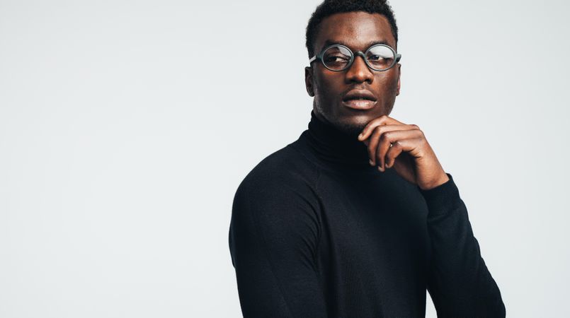 Black male in glasses and turtle neck