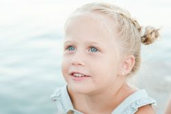 Charming girl against sea at beach