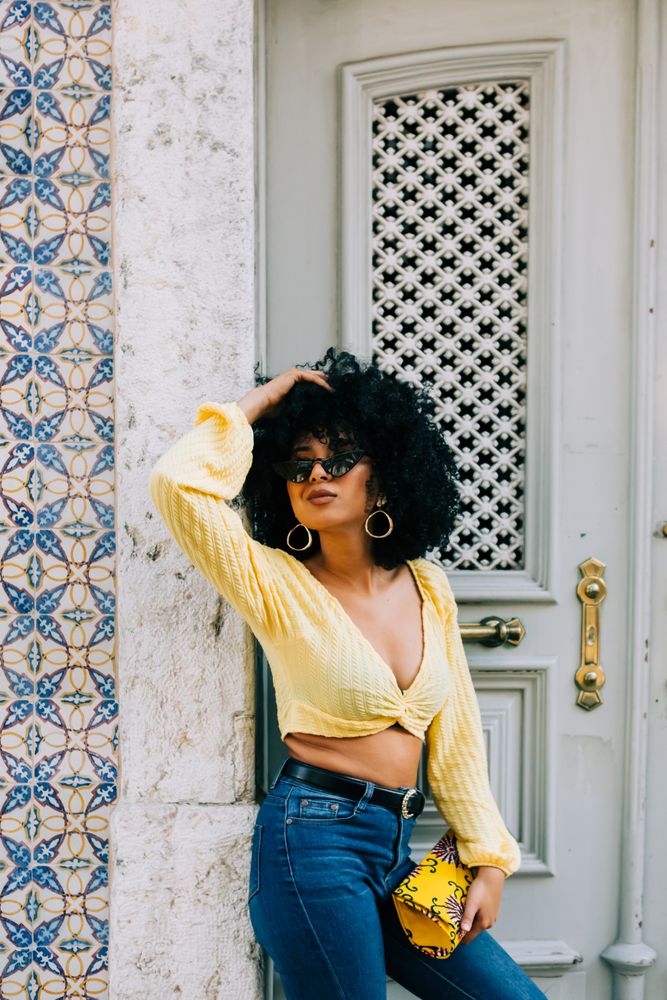 Fashionable female by gray door