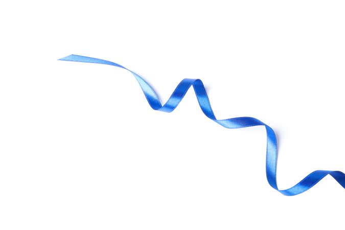 Blue ribbon isolated on plain background. Gift concept