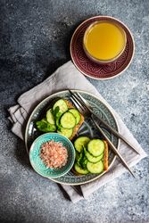 Top view of healthy lunch with vegetable cucumber toast and Himalayan salt