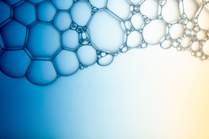 Abstract background bio technology, macro photography foam and water with gradient background. Molecule multicolor backgorund